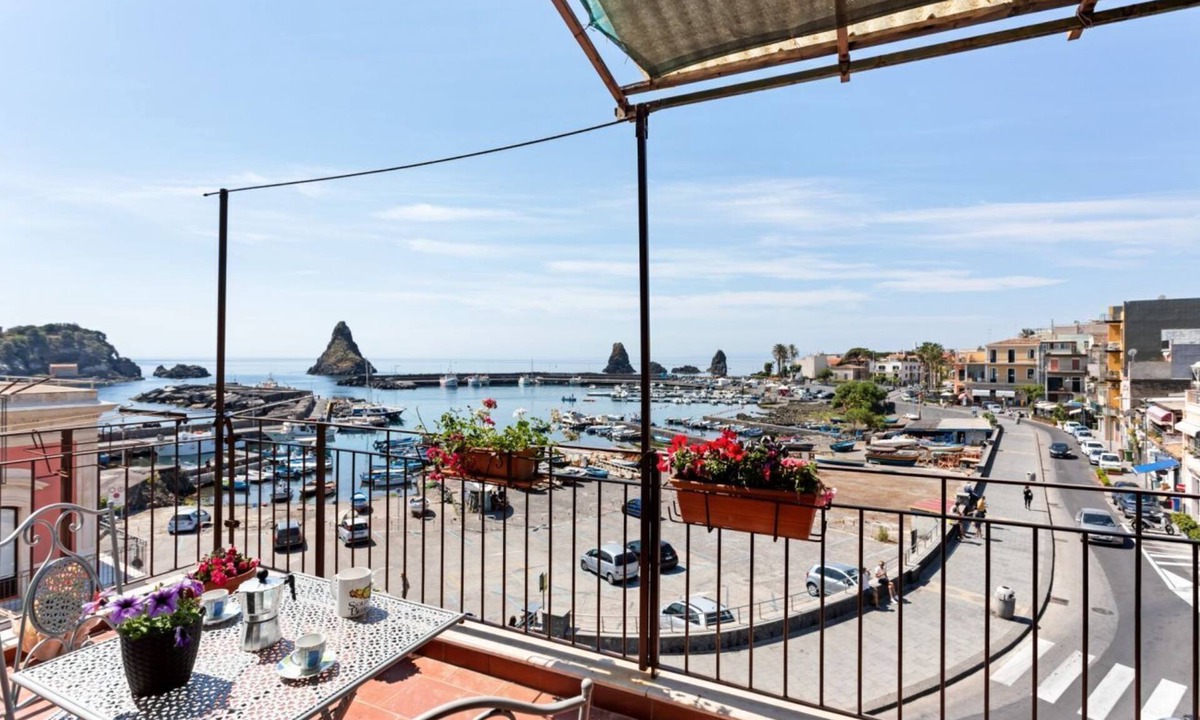 Aci Trezza Apartment | GuestHost - This comfortable 80sqm apartment can accommodate up to 3 people (distributed over 2 levels with internal stairs) located on the first floor, without a lift, of a characteristic building overlooking the Cyclops Riviera and Lachea Island. In 5