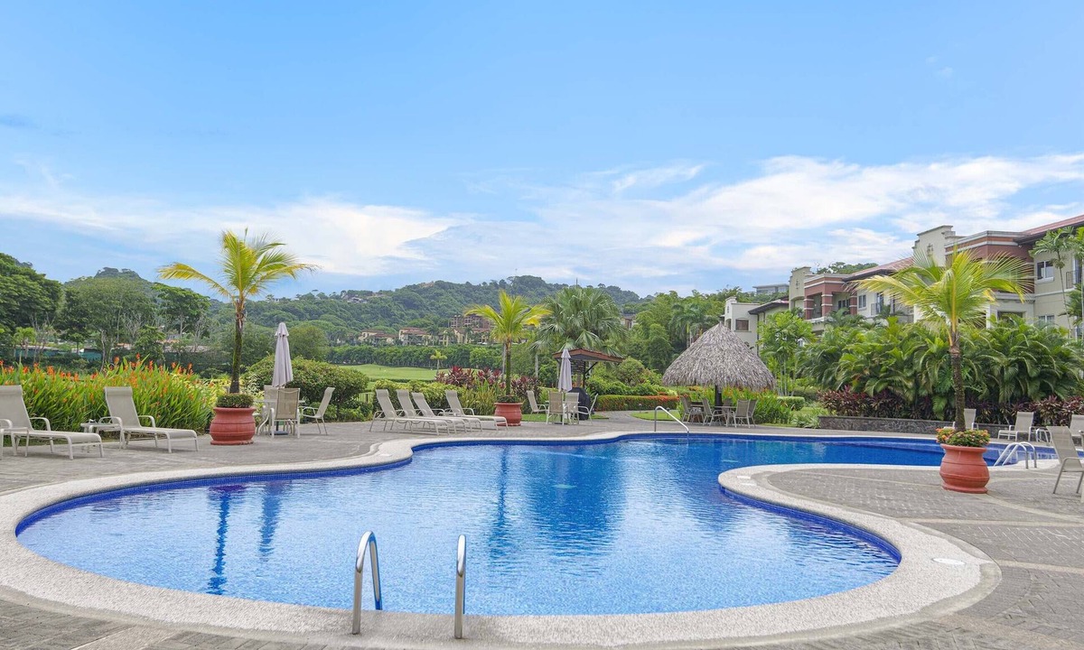 Herradura Condo | Luxurious Ground Floor Condo: Proximity to Pool, Full Access to Amenities.
