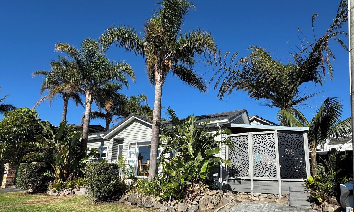 Browns Bay Cottage | Your coastal escape. Walk to the beach. Private spa, whole house access.
