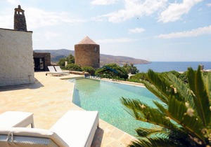 Unique stone villa with a swimming pool and sea view in Koundouros