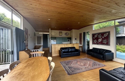 Raglan House | Sunny with decks and bush/harbour views. Three bedrooms. Pet friendly.