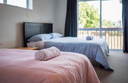 Browns Bay House | 7BR 3BH Beach Escape. 2 min to Browns Bay Beach