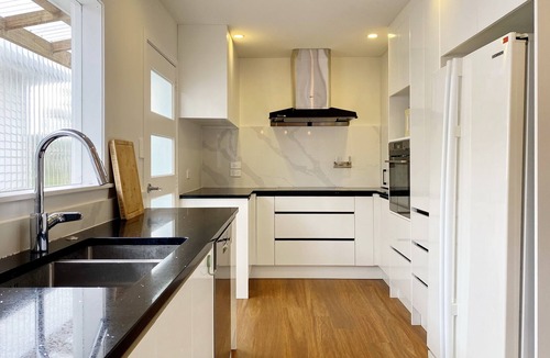 Browns Bay House | 7BR 3BH Beach Escape. 2 min to Browns Bay Beach