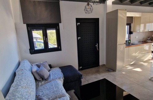 Goudhouros Villa | Casa di Olive, a villa with fireplace and sea view