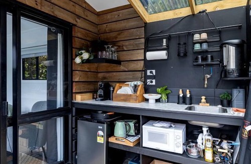 New Plymouth Cabin | Charming Tiny House Surrounded by Trees in New Plymouth, North Island