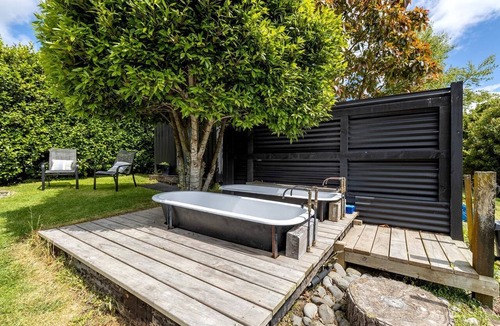 New Plymouth Cabin | Charming Tiny House Surrounded by Trees in New Plymouth, North Island