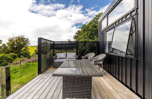 New Plymouth Cabin | Charming Tiny House Surrounded by Trees in New Plymouth, North Island