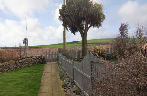 Drummore Cottage | Delightful cottage overlooking Luce Bay, with open fire and enclosed garden.