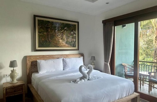 Pengosekan Bed & Breakfast | Deluxe Double Room with Balcony at Mandala Home Stay
