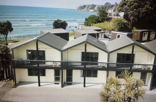 Maketu Apartment | Family room, come and enjoy the magical sunset on the balcony, Pet Friendly