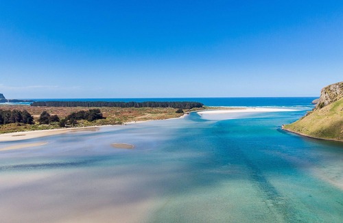 Cape Saunders Resort | Kahu Studio Wake up with a stunning view from the Papanui Inlet