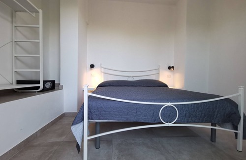 Santa Domenica Apartment | Modern apartment with communal pool surrounded by a beautiful garden