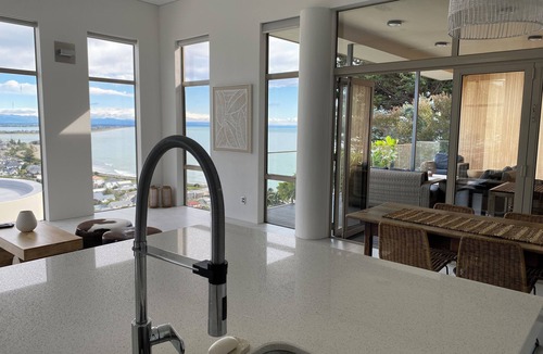Sumner House | Ocean-view escape: 4 bedrooms, heated pool, sauna, and expansive terraces