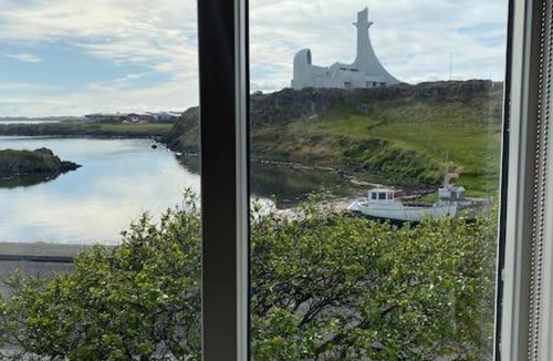 Stykkisholmur Villa | Oceanfront holiday home with outdoor hot tub.
