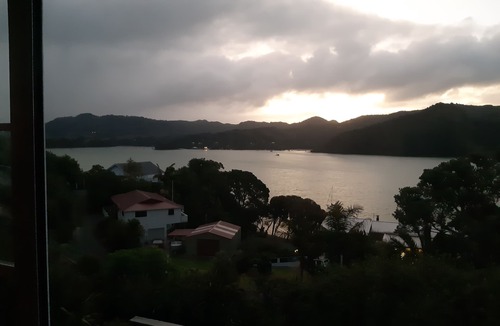 Whangaroa Ski Chalet | One Bedroom Unit with bathroom and small living area with kitchenette.