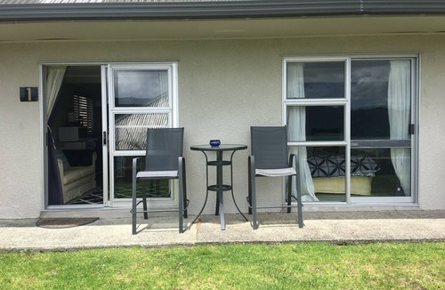 Whangaroa Ski Chalet | One Bedroom Unit with bathroom and small living area with kitchenette.