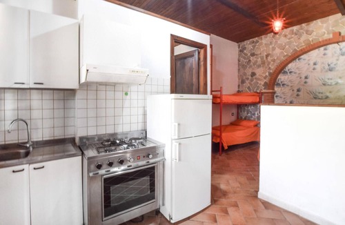 Praia a Mare Apartment | Practical apartment with open terrace and communal pool.
