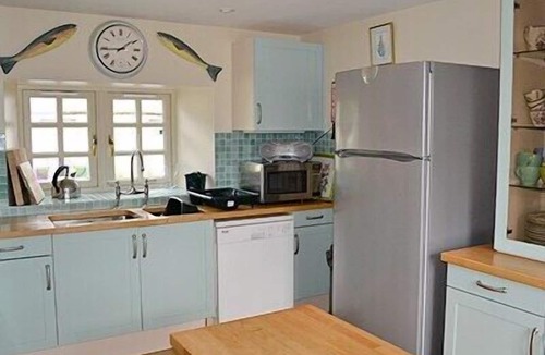 Lairg Cottage | Relax and unwind in this cosy croft house with a woodburner.