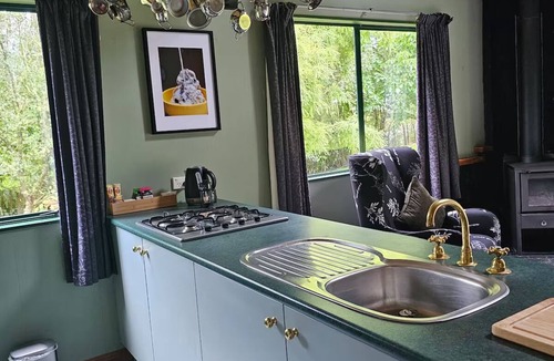 Ngaruawahia Cottage | Retreat into nature, in rural Ngaruawahia.nRelax in the outdoor bath.