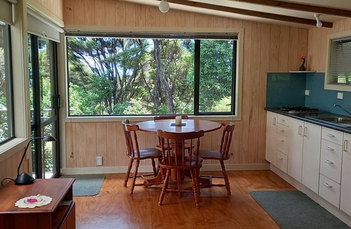Russell House | Te Oneroa Hill, 5 acres of native park with wonderful sea view.