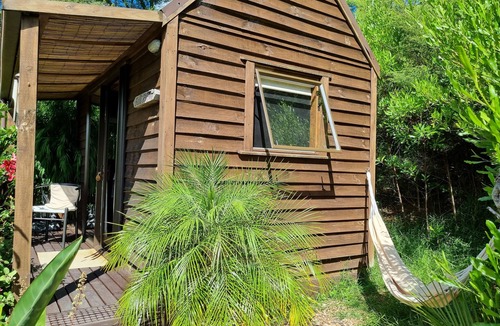 Coromandel Cabin | The Bali Room-Part of Coromandel Eco Sanctuary. Pet Friendly/Wi-Fi/Chimenea Fire