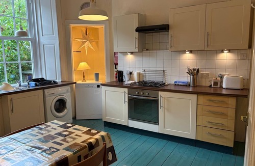 Port Bannatyne Apartment | Tideline. Waterfront ground floor spacious flat with garden and open sea views