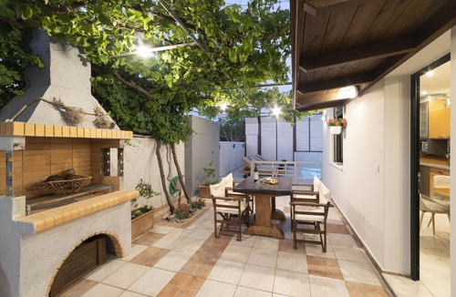 Koutsouras Condo | Two bedroom luxury condo with private patio with vineyard & BBQ near beach