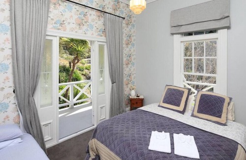 Oneroa House | With a private beach and secluded location