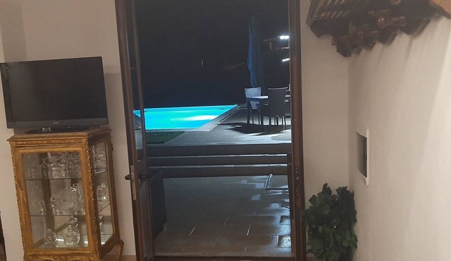 A fully equipped, comfortable, and cozy studio apartment with a pool