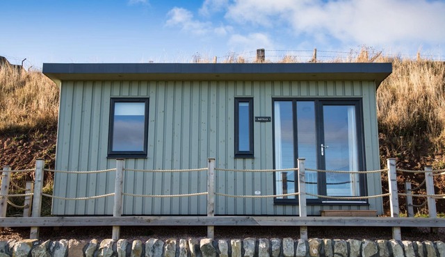 A standard beach hut that sleeps 4 guests in 1 bedroom