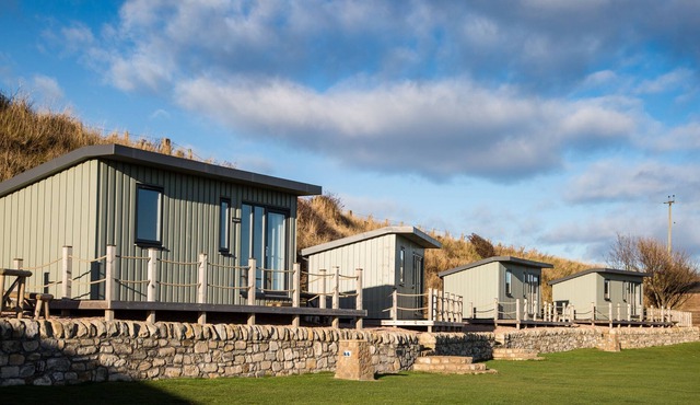 A standard beach hut that sleeps 4 guests in 1 bedroom