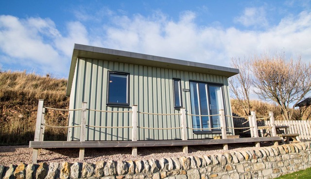 A standard beach hut that sleeps 4 guests in 1 bedroom