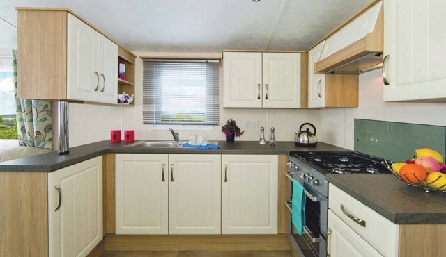 Comfortable and spacious 12ft-wide caravan with one double and one twin.