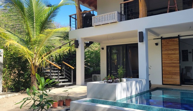 New Modern Home. pool. 5 min walk beach. horses. 2 BR, 1 bath, gated parking.