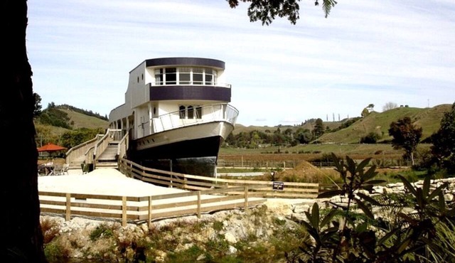 Renovated Historical WWII Ship on Land in Waitomo, New Zealand