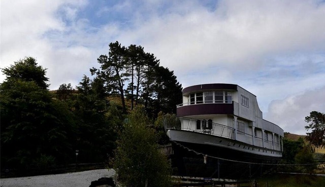 Romantic Getaway Accommodation on a World War II Ship near Waitomo Caves, North Island