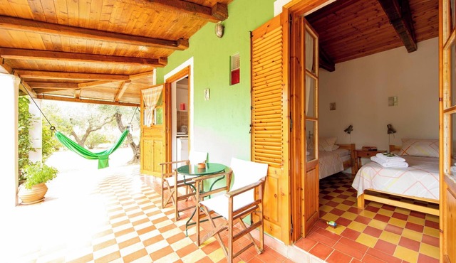 Self catered Daphnes cottage #4 with large veranda and garden near the beach.
