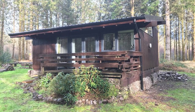 SKERRY is an authentic log cabin in a lovely forest location close to Loch Awe