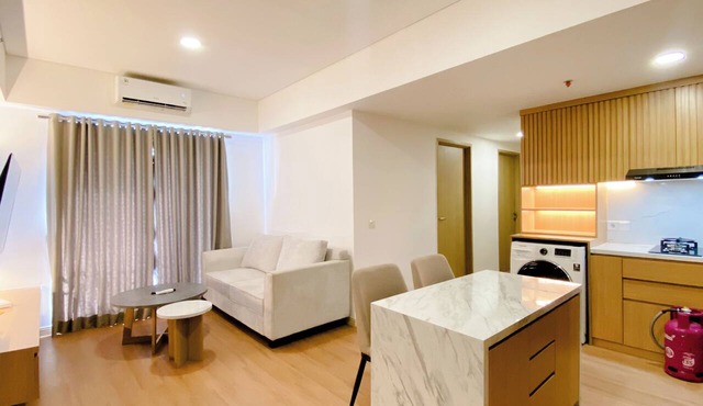 Spacious And Homey 2Br With Work Space At Meikarta Apartment