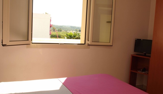 Two-room attic apartment with a view only 100 meters from Torre Mozza beach