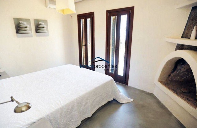Unique stone villa with a swimming pool and sea view in Koundouros